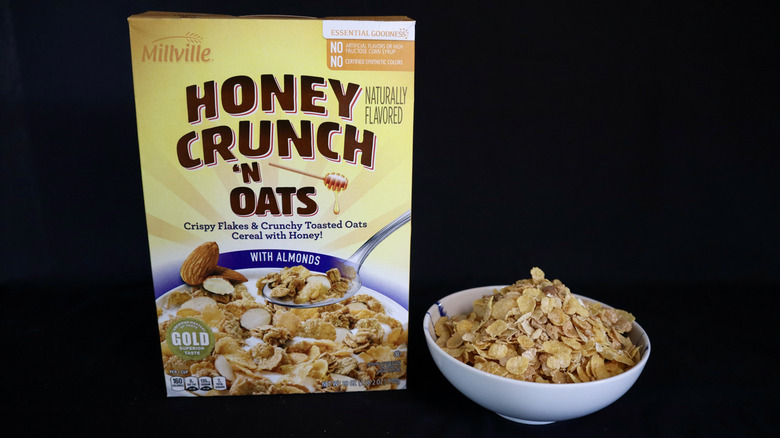 Honey Crunch 'n Oats with Almonds box next to a bowl of cereal.