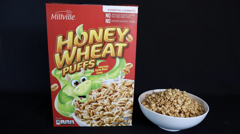 Honey Wheat Puffs box next to a bowl of cereal.