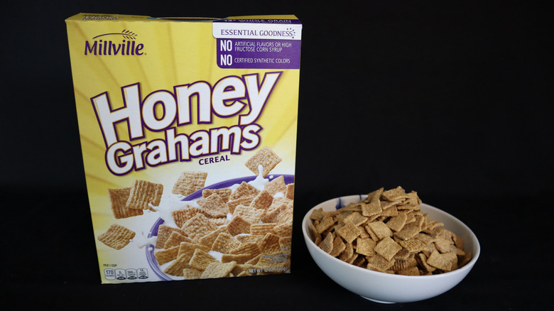 Honey Grahams box next to a bowl of cereal.