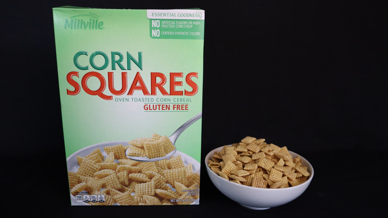 Corn Squares box next to a bowl of cereal.