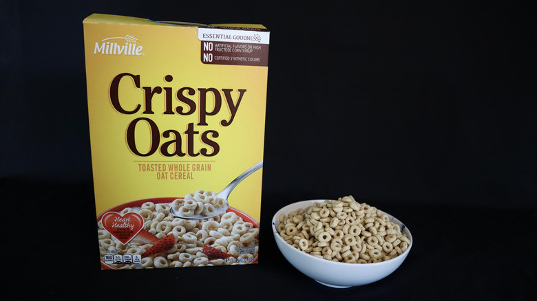 Box of Crispy Oats next to a bowl of cereal.