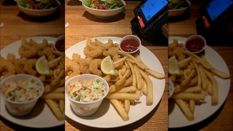 Plate of fried shrimp, fries, and coleslaw from Applebee's