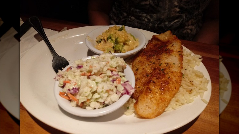 Meal from Cheddar's Scratch Kitchen, with coleslaw, swai fish, and rice