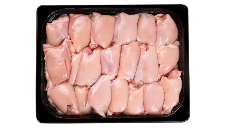 Raw boneless thighs black tray