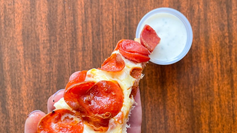 Pizza slice with ranch