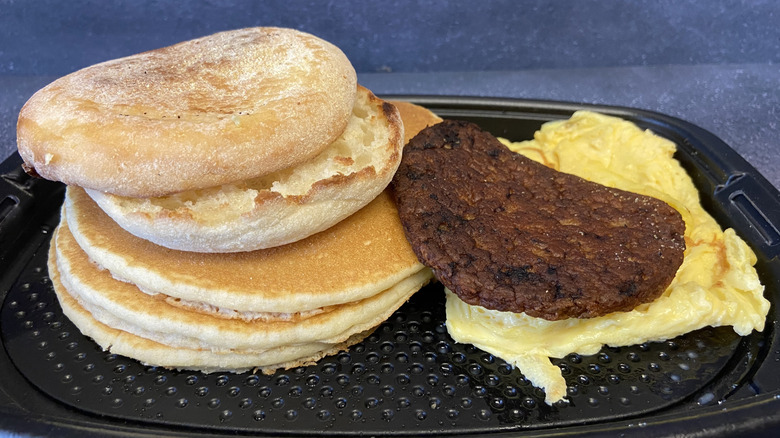 Big Breakfast with hotcakes from McDonald's with English muffin, pancakes, sausage, and eggs