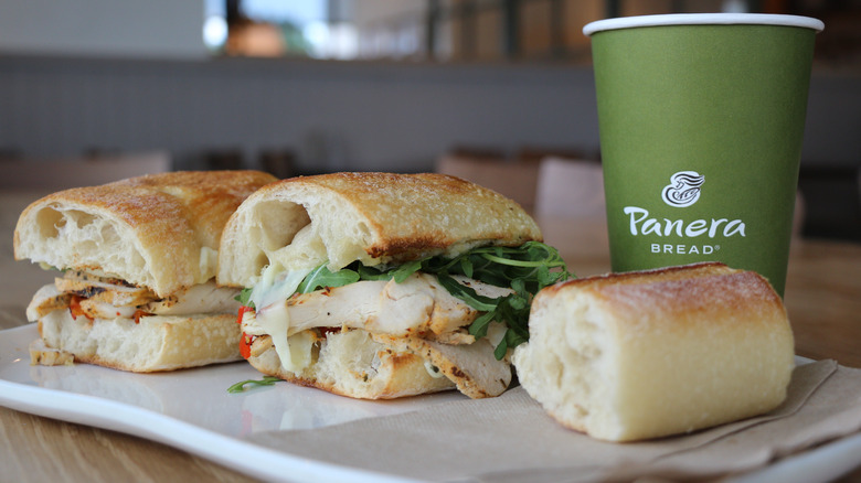 Panera cup, turkey sandwich, and side of baguette