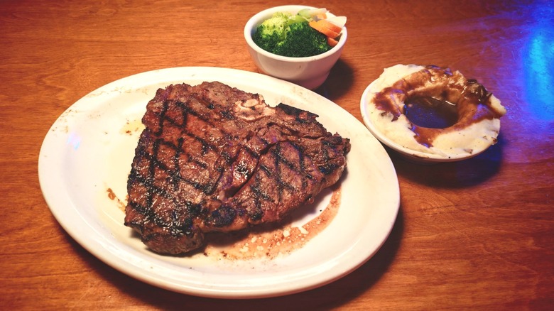 Texas Roadhouse porterhouse with mixed veggies and mashed potatoes with gravy