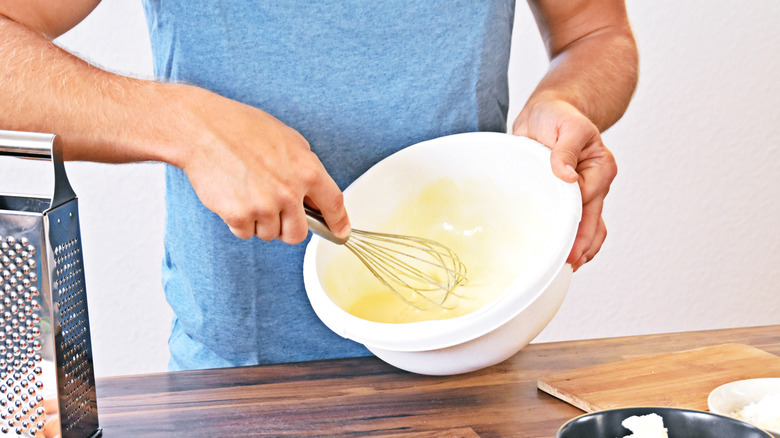 person mixing custard filling