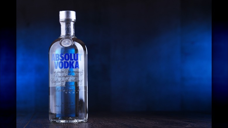 Absolut Vodka bottle on blue background