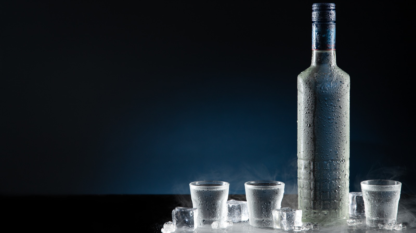 6 Litre Belvedere Vodka with light in base next to a stand…