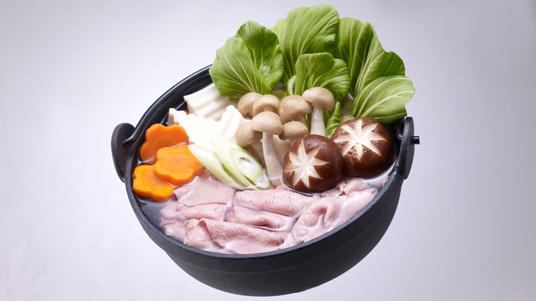 Bowl of sukiyaki tilted toward viewer