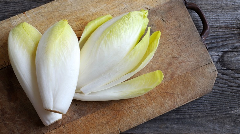 Belgian endive on cutting board