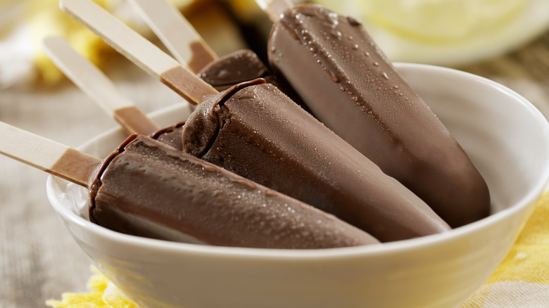 Chocolate popsicles in bowl