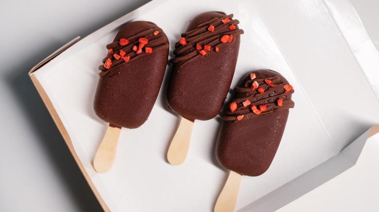 Chocolate popsicle with nuts