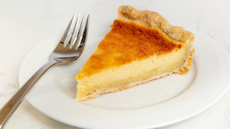 Slice of chess pie with spoon