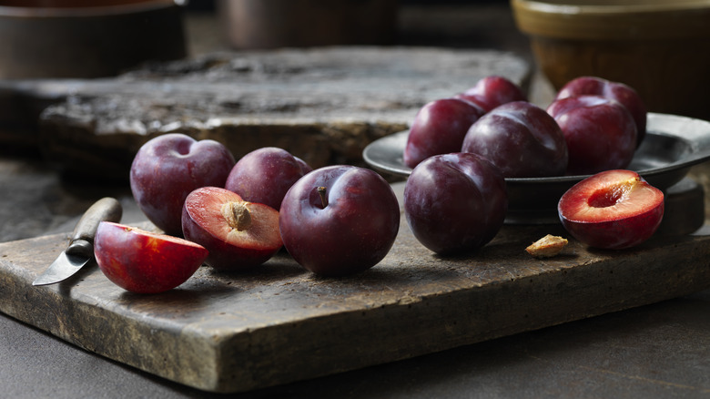 Plums on a cutting board