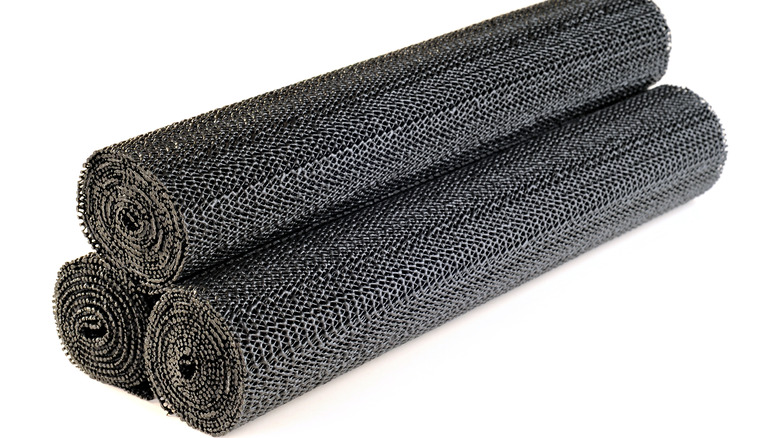 Rolls of black shelf liner