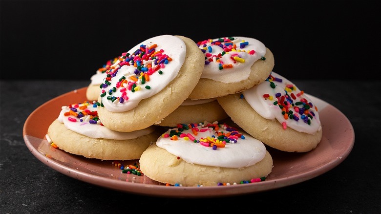 Frosted cookies with rainbow sprinkles 