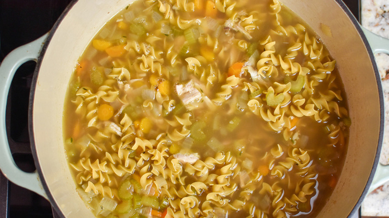 A pot of chicken noodle soup