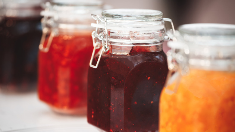 different jam flavors in glass jars