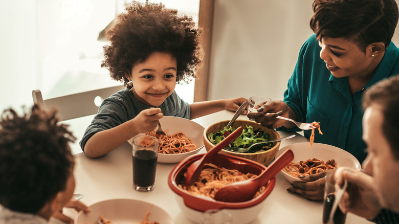 family eating pasta together