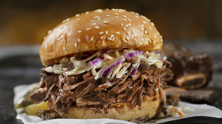 Coleslaw on a pulled pork sandwich