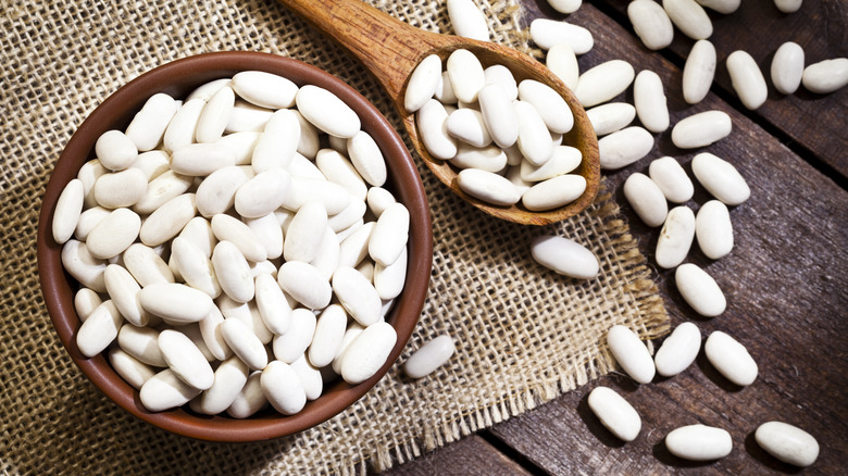 White beans scattered from bowl