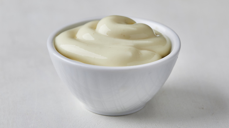 Bowl of mayonnaise white background