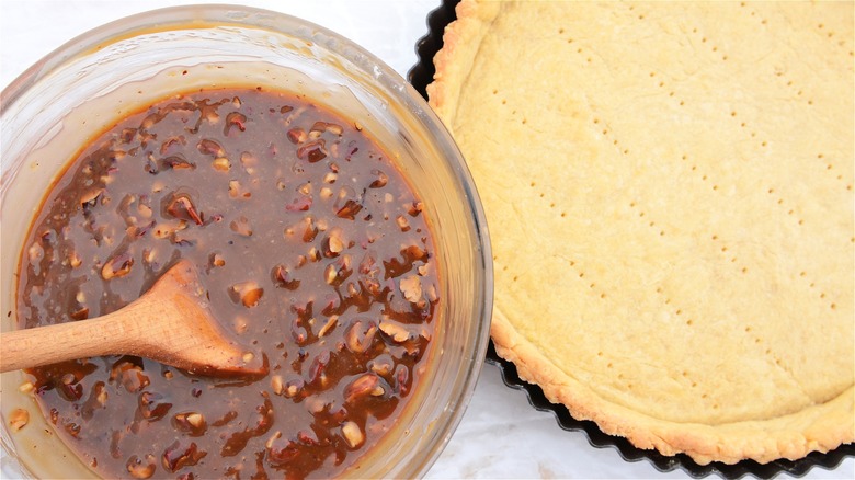 Baked pie crust with pecan filling 