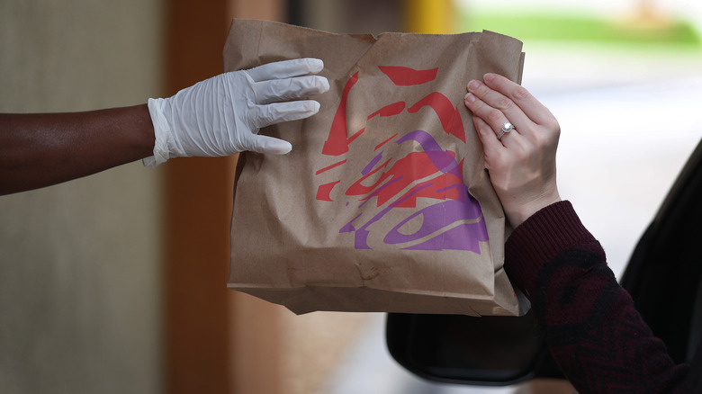 Taco Bell customer taking takeout bag