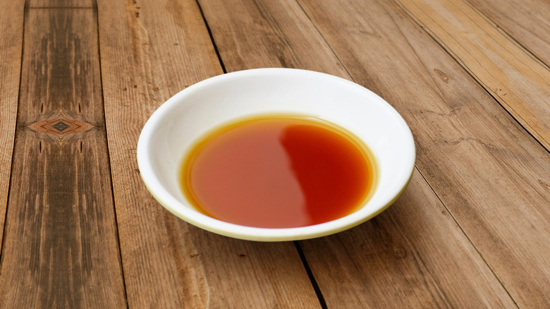 bowl of fish sauce on wooden table