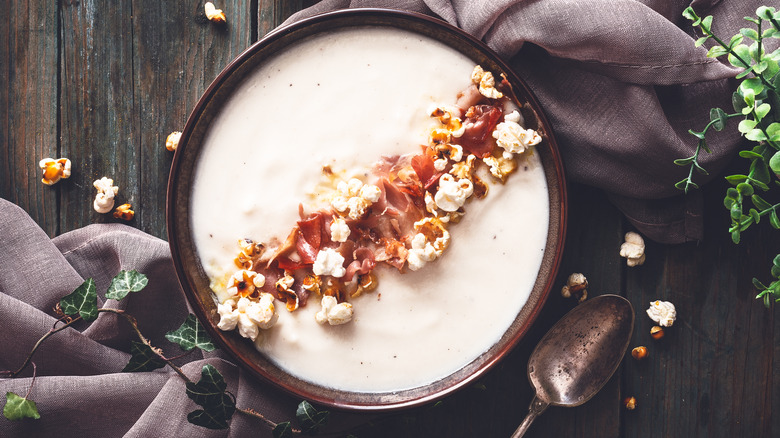 soup topped with popcorn and bacon