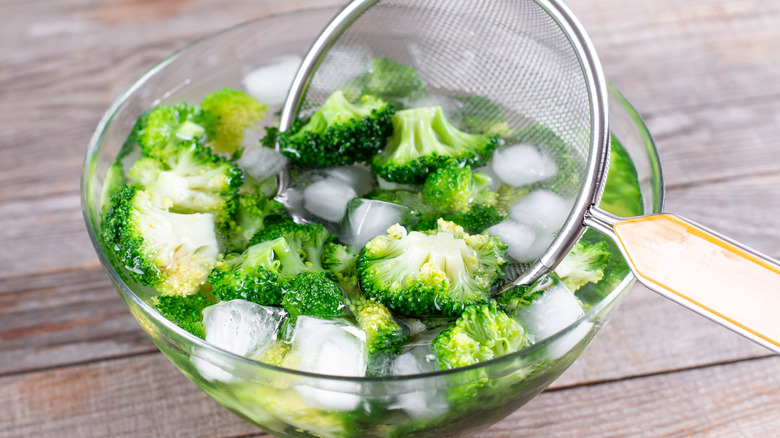 cooked broccoli in ice bath