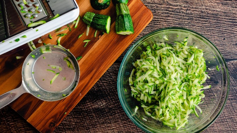 shredded zucchini in a glass bowl