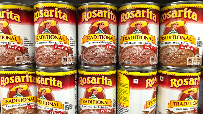 Refried bean cans on shelf