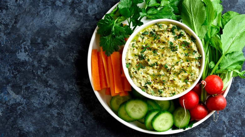 Chip and dip bowl with fresh raw chopped vegetables