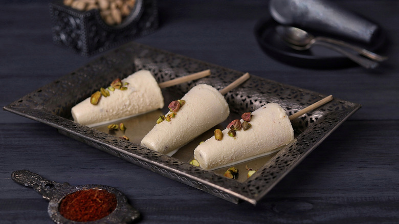 Cones of kulfi on sticks