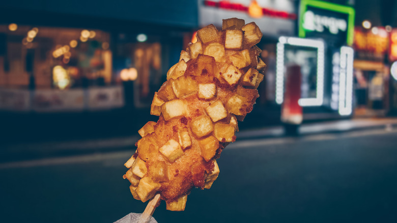 Korean corn dog with street in the background