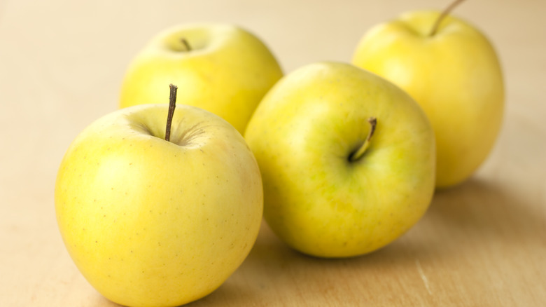 Yellow apples on a table