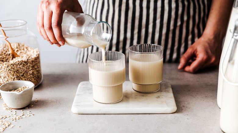 plant based milk poured into glasses