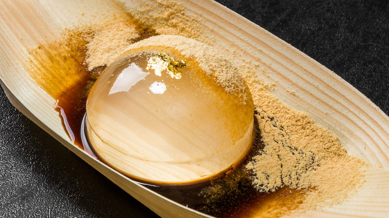 Raindrop cake with kinako dusted over dome