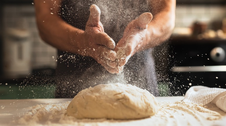 kneading a ball of dough 