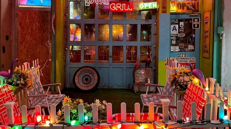 Bar decor with garden furniture and neon signs