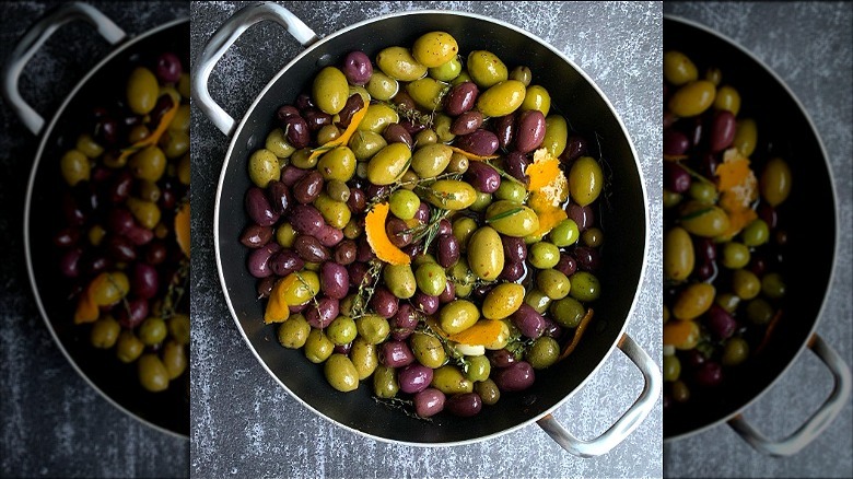 Saucepan filled with marinated olives 