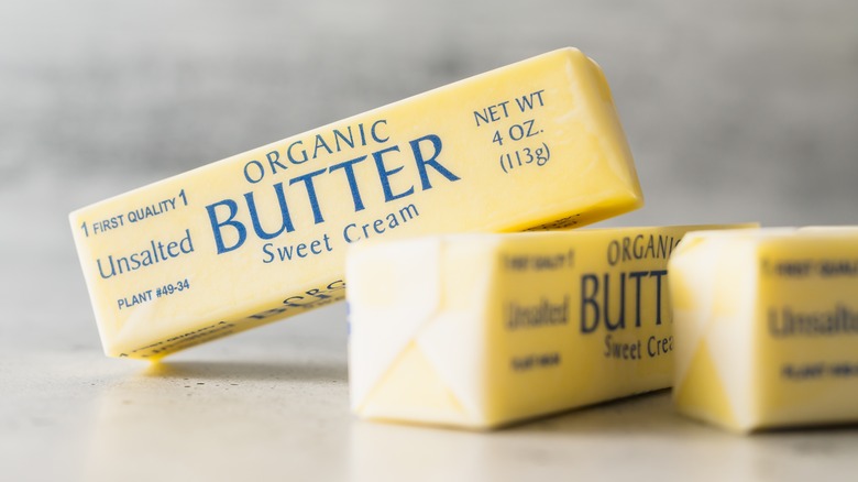 Sticks of butter wrapped on counter