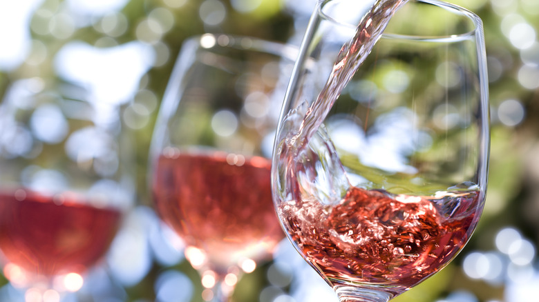 pouring glass of rosé wine