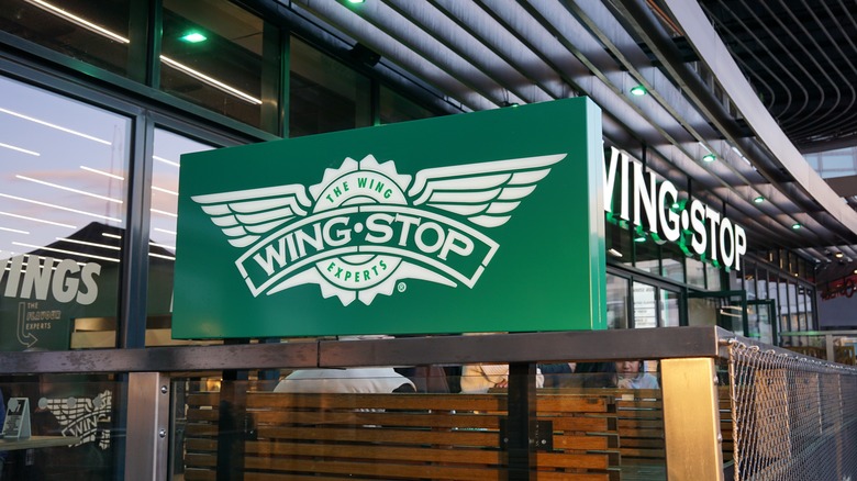 green wingstop sign in front of entrance