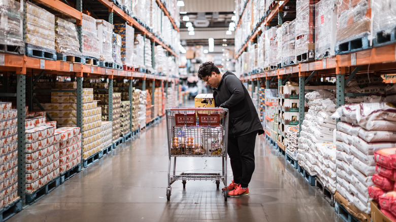 woman in Costco shopping aisle