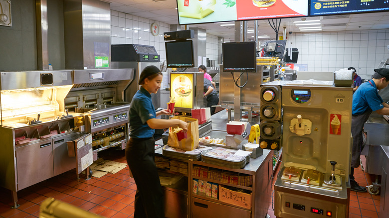 Employees inside a McDonald's kitchen